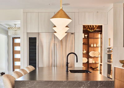 Modern kitchen with minimalist design and unique pendant lighting.