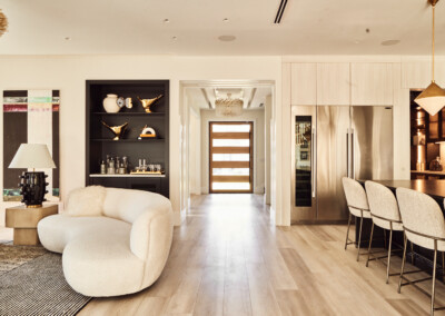 Modern kitchen with cozy seating and elegant dining area.