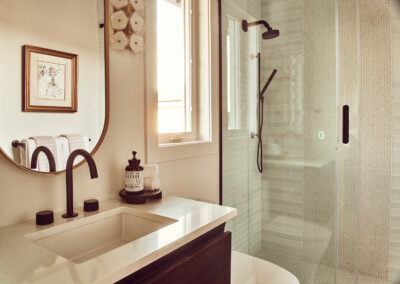 Elegant bathroom with modern fixtures and warm lighting.