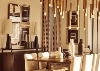 Elegant dining room with modern chairs and vertical wall decor.
