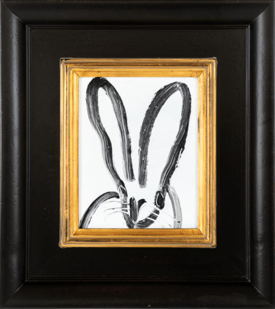 Minimalist black and white rabbit sketch in an ornate frame. Minimalist black and white rabbit sketch in an ornate frame.