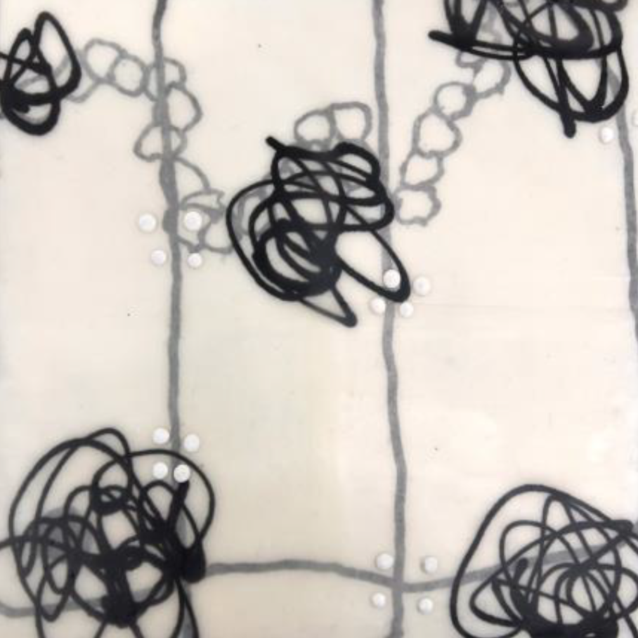 Abstract black ink scribbles on a white background connected by thin lines.