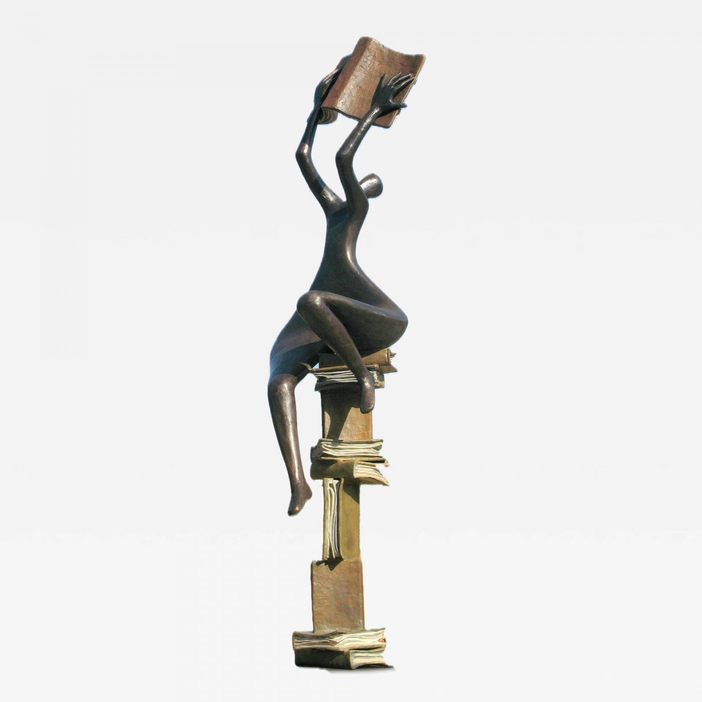 Abstract sculpture of a figure holding a book, balanced on stacked books.