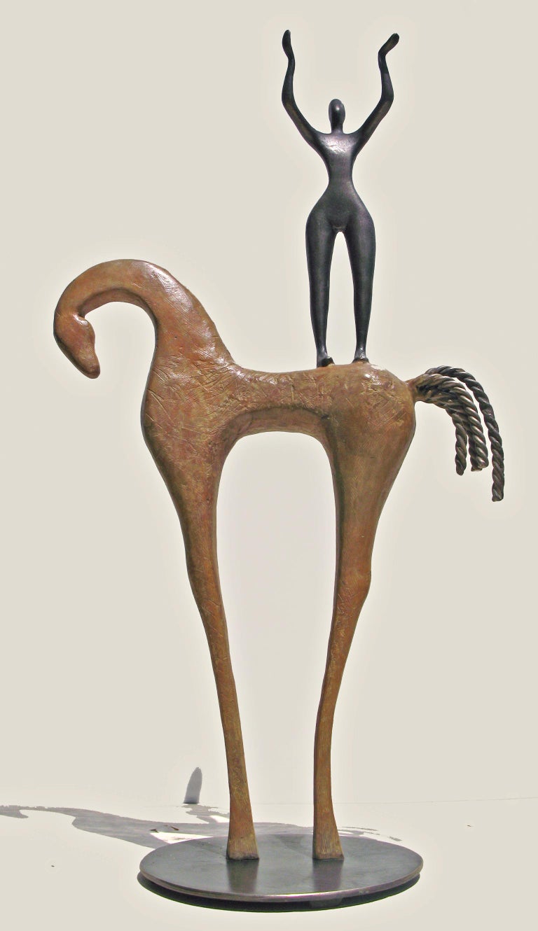 Abstract sculpture of a horse with a figure on its back.