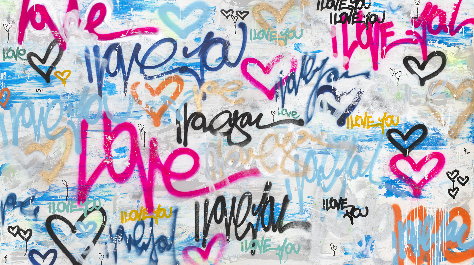 Colorful graffiti wall with various 'love' inscriptions and heart drawings.