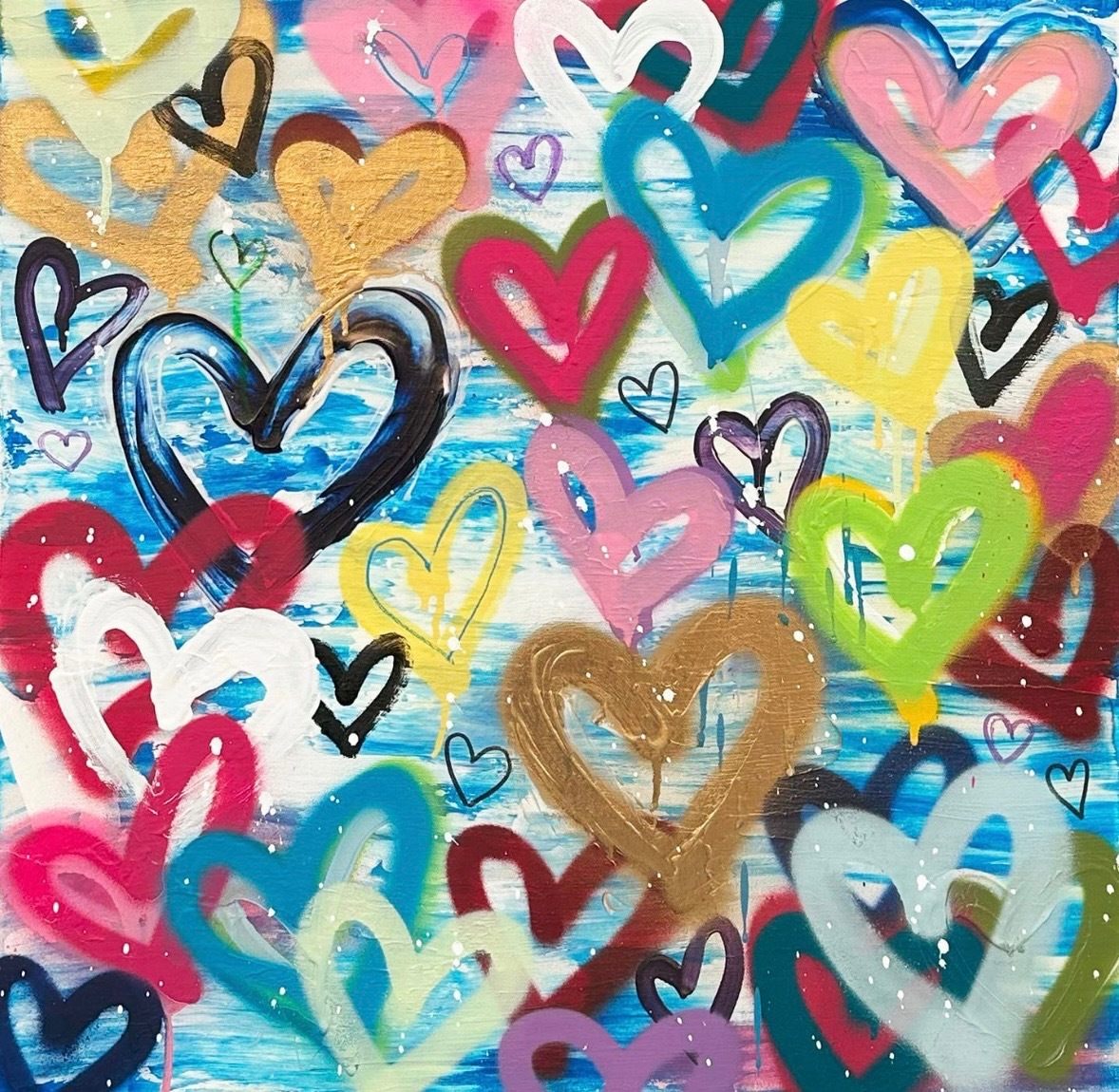 Colorful graffiti of overlapping hearts on a wall.