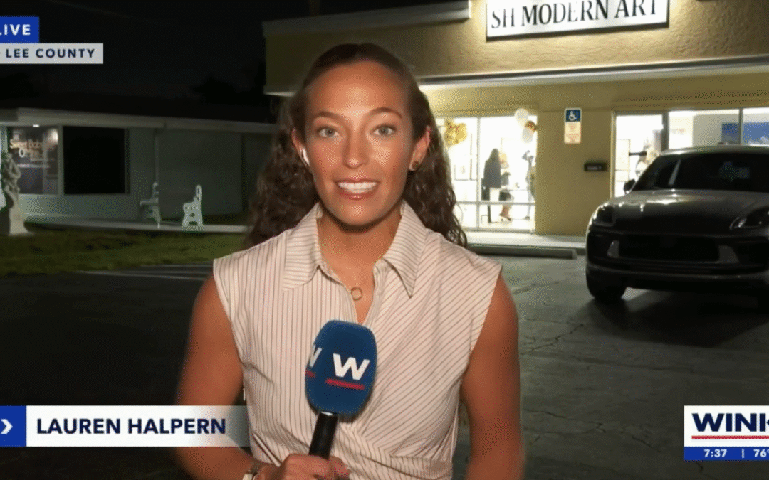 Reporter delivering news outside a medical facility at night.